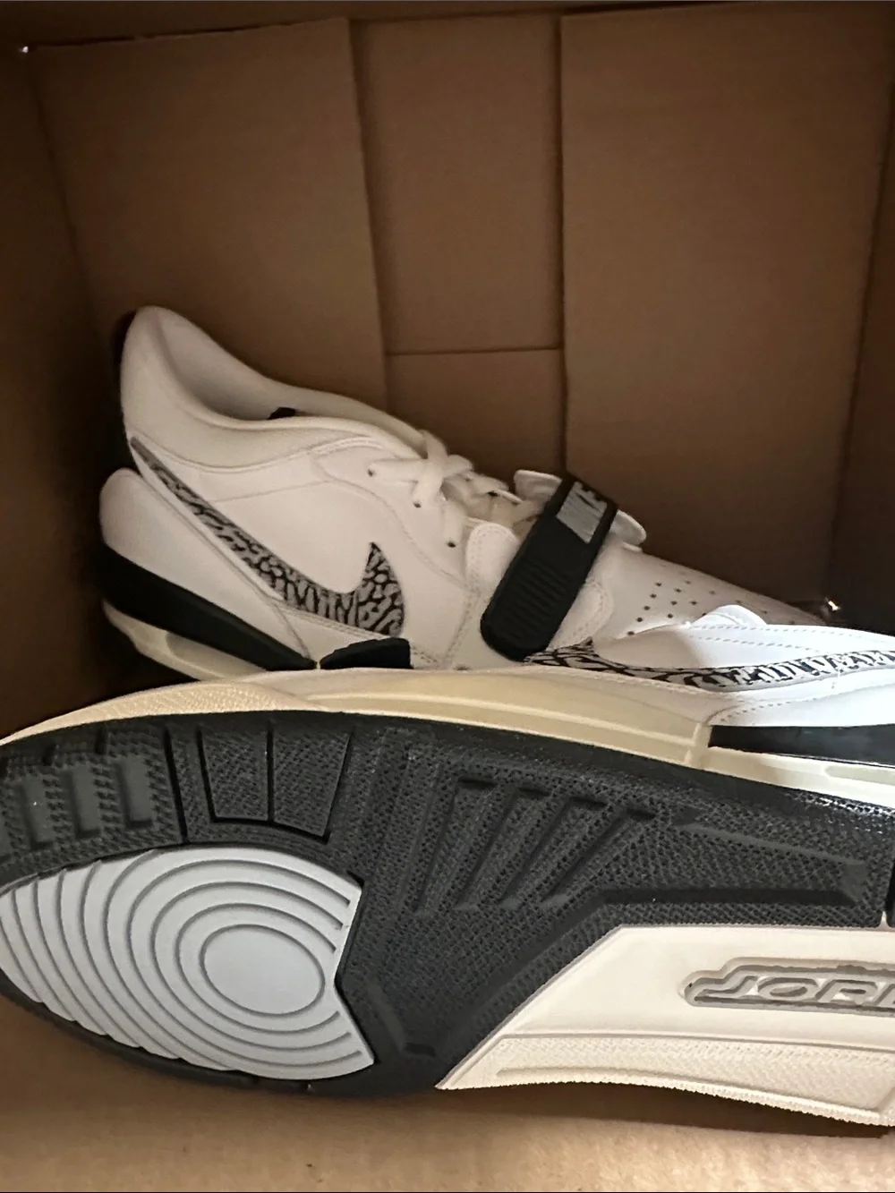 Nike Jordan Men’s White and Black Low-Top Sneakers with Patterned Swoosh